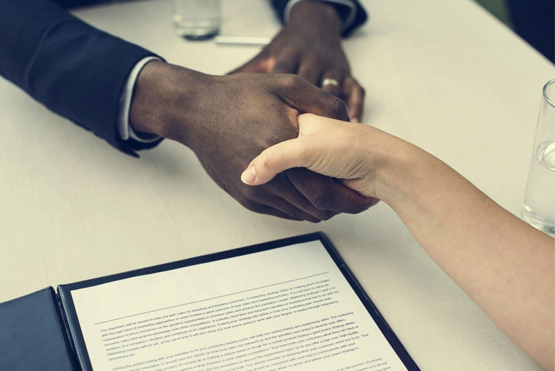 Business handshake representing
